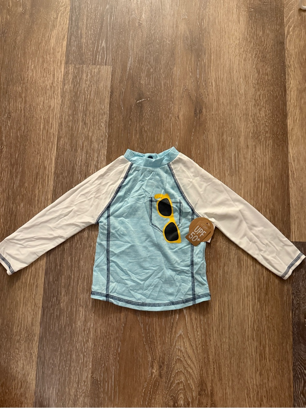 Mud Pie Light Blue and White Kids Rash Guard with Sunglasses Pocket Graphic